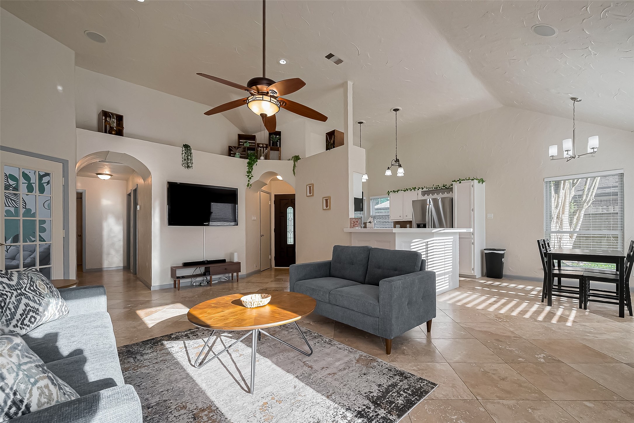 30411 Arborg Drive Spring, TX 77386 - Photo 5 of 30 a living room with furniture a dining table and a fireplace