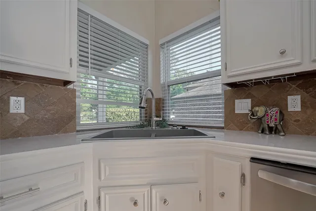 a kitchen with a sink and a window