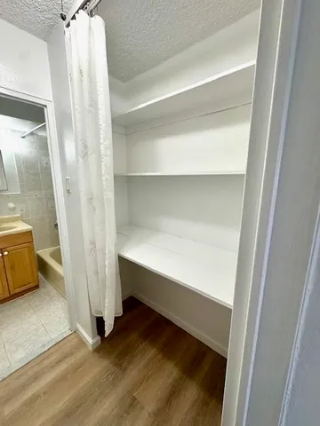 a storage room with wooden floor