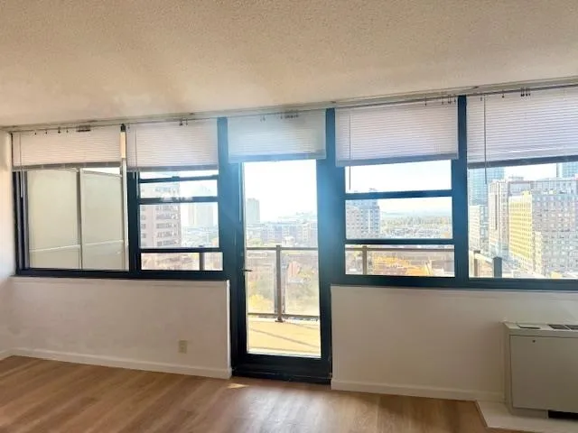 a view of an empty room with a window