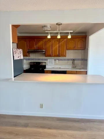 a view of a kitchen with a bathtub