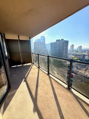 a view of a floor to ceiling window and an outdoor space