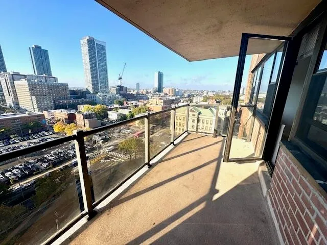a view of a living room with furniture and a fireplace