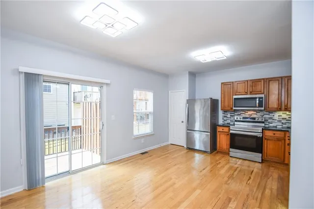 a bathroom with a sink a shower and a mirror