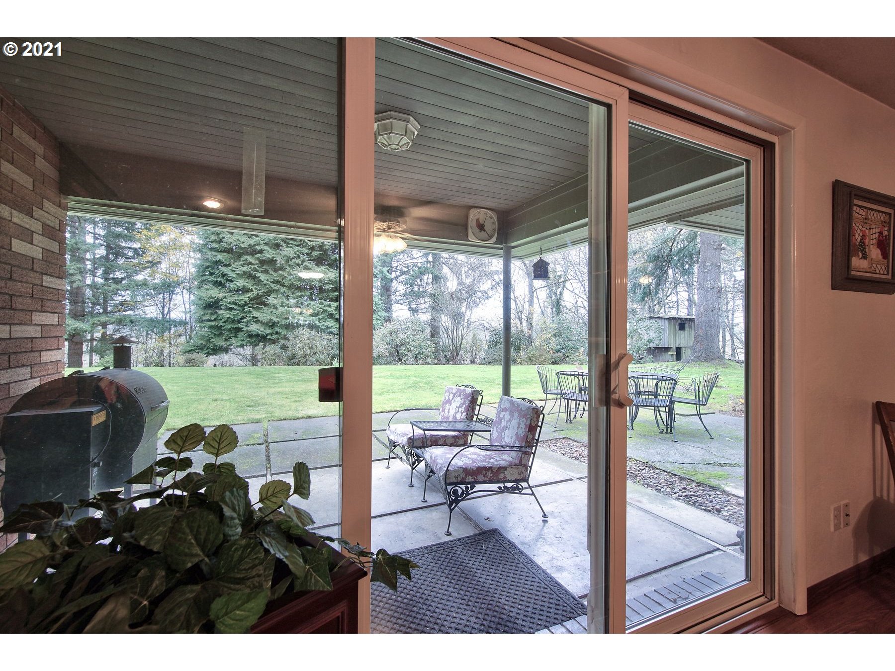 29223 South Meridian Road Hubbard, OR 97032 - Photo 12 of 32 a balcony view with a lot of couches and table