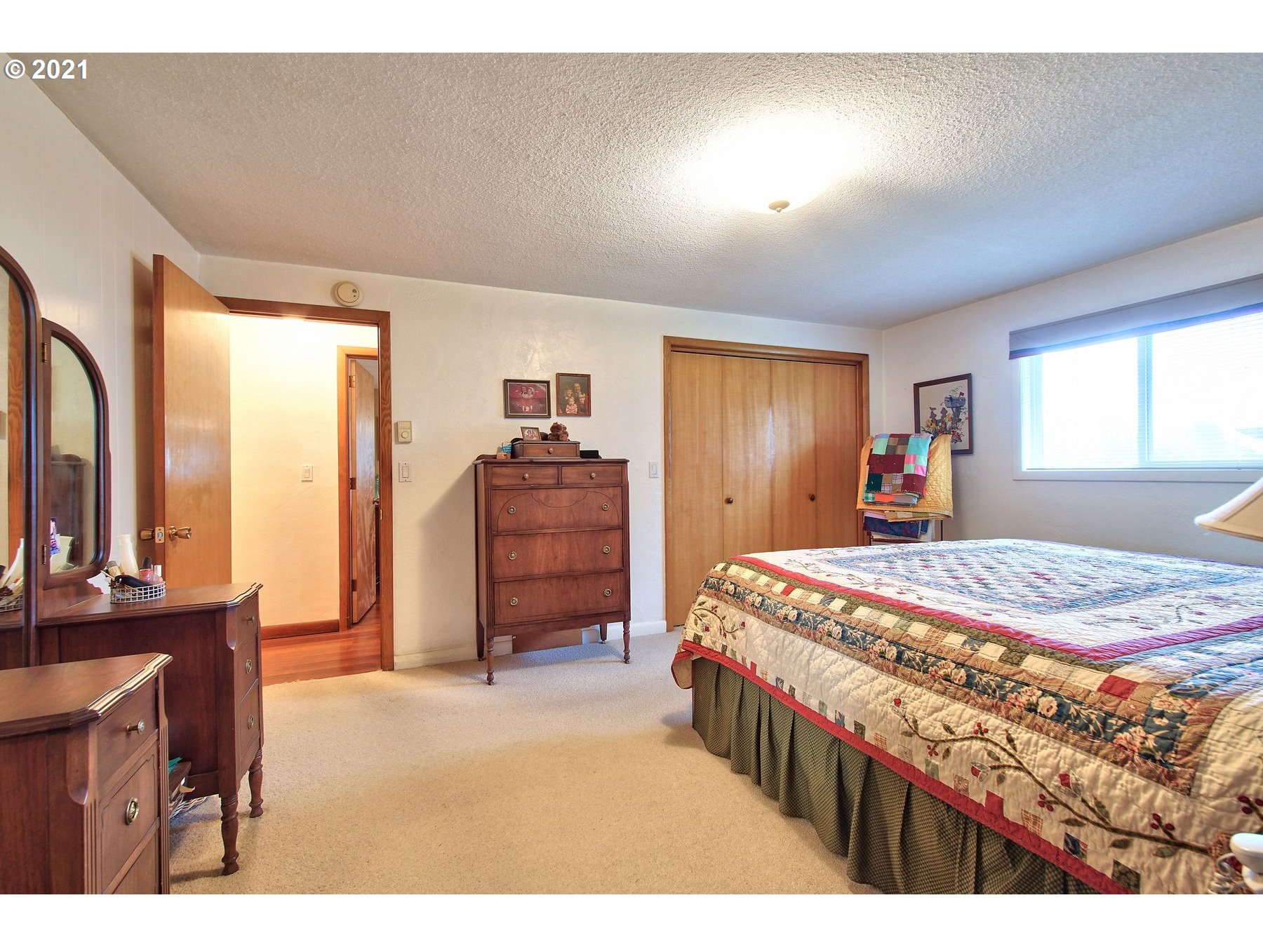 29223 South Meridian Road Hubbard, OR 97032 - Photo 20 of 32 a bedroom with a bed a dresser and large mirror