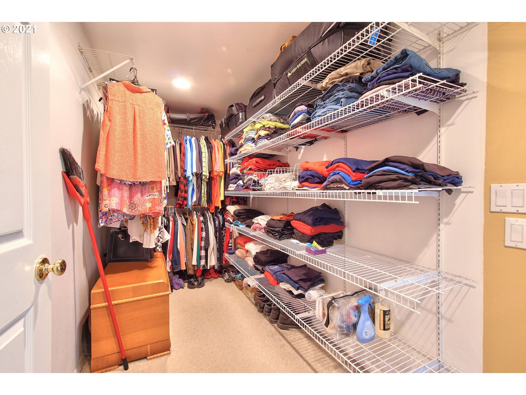 29223 South Meridian Road Hubbard, OR 97032 - Photo 21 of 32 a room with lots of different colored cloths