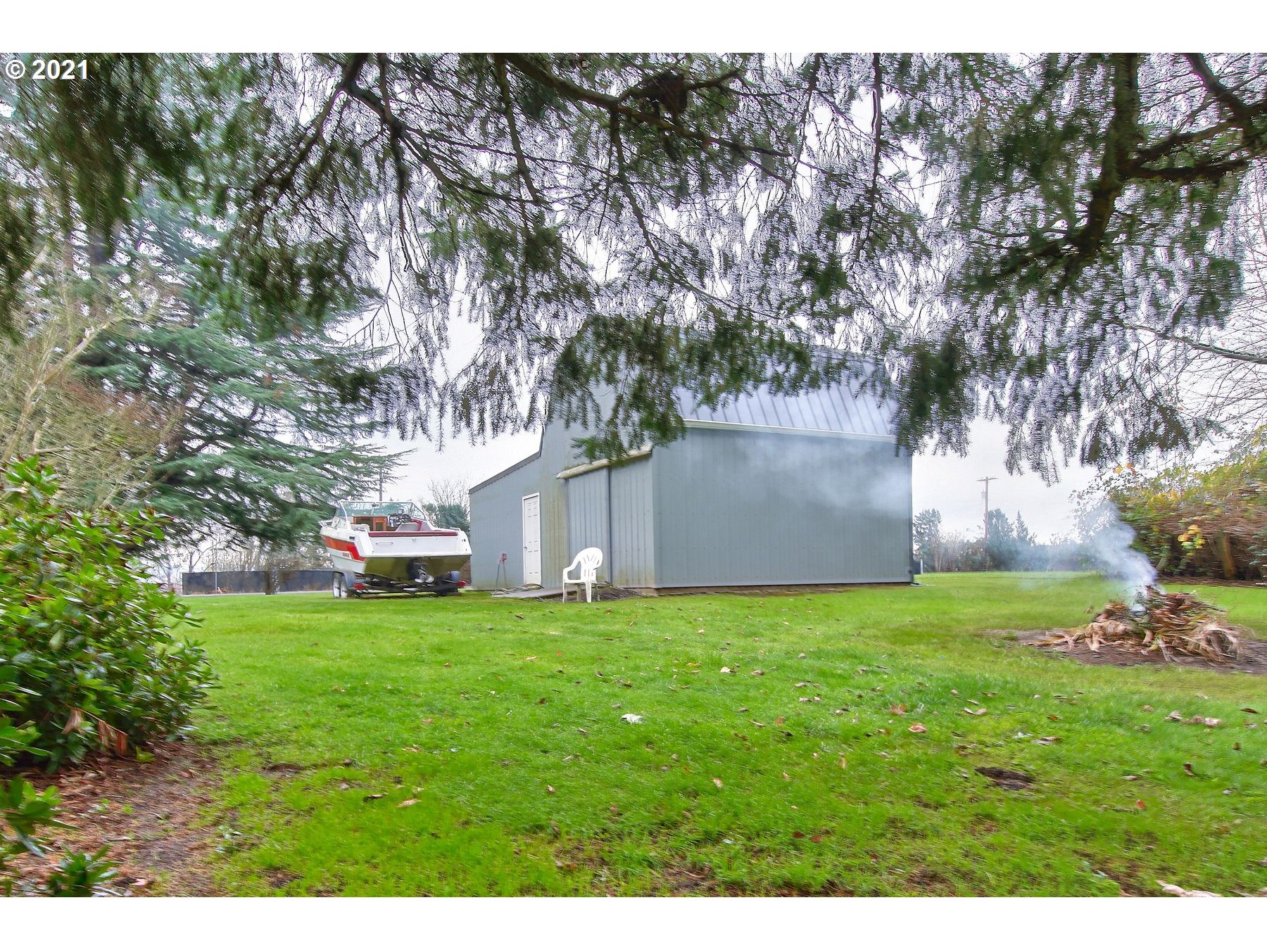 29223 South Meridian Road Hubbard, OR 97032 - Photo 25 of 32 a view of a backyard with large trees