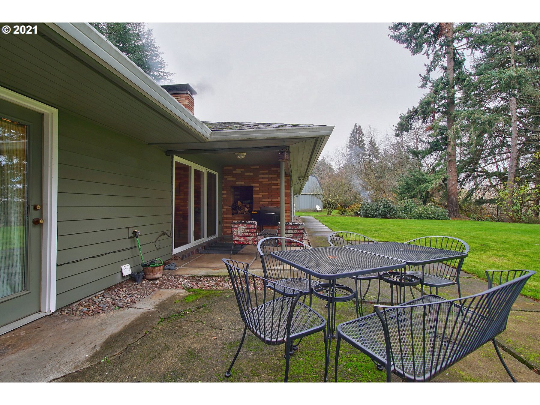 29223 South Meridian Road Hubbard, OR 97032 - Photo 26 of 32 a patio with table and chairs
