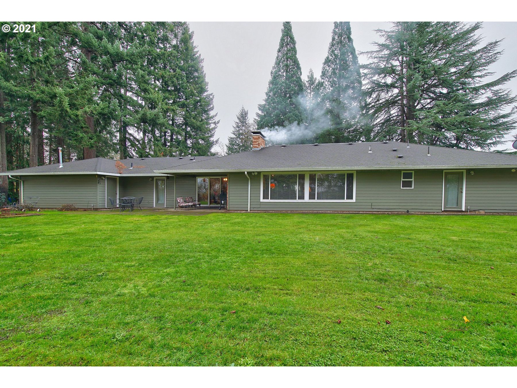 29223 South Meridian Road Hubbard, OR 97032 - Photo 27 of 32 a front view of a house with a garden