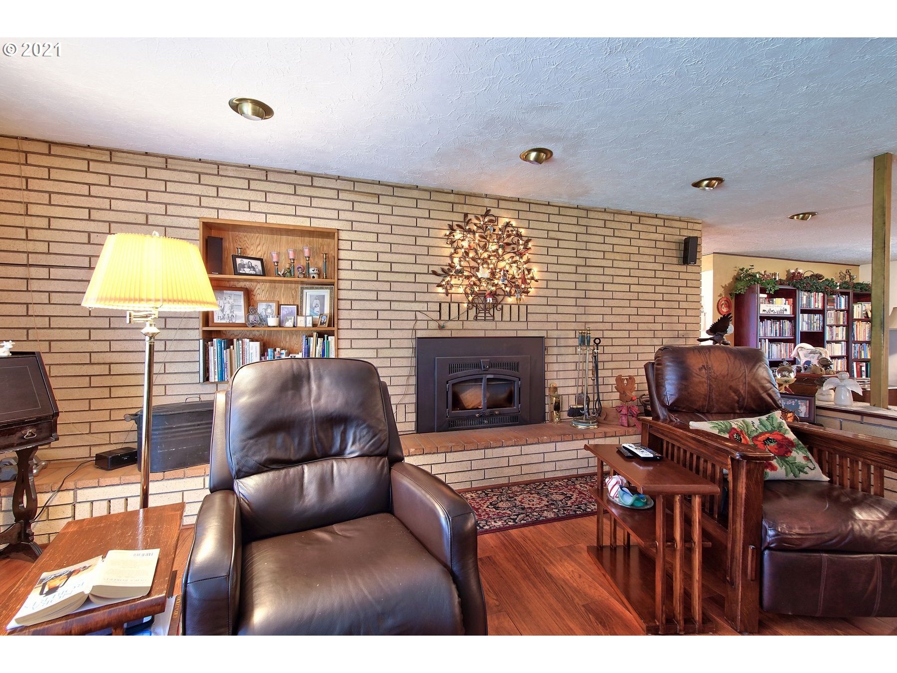 29223 South Meridian Road Hubbard, OR 97032 - Photo 5 of 32 a living room with furniture and a fireplace