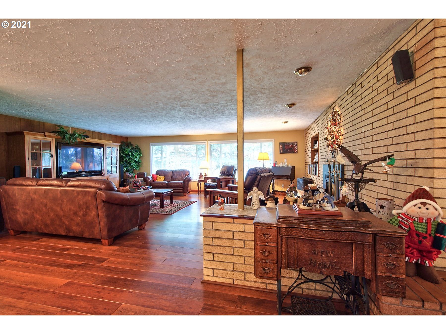 29223 South Meridian Road Hubbard, OR 97032 - Photo 7 of 32 a living room with lots of furniture and a wooden floor