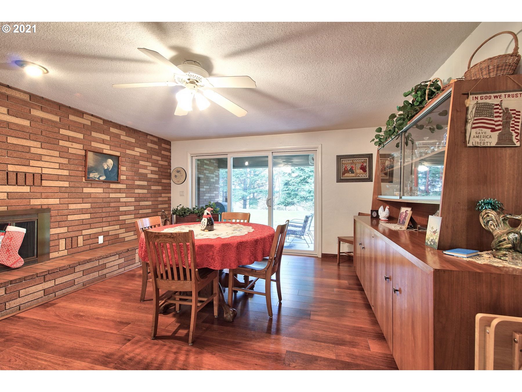 29223 South Meridian Road Hubbard, OR 97032 - Photo 9 of 32 a dining room with furniture a chandelier and wooden floor