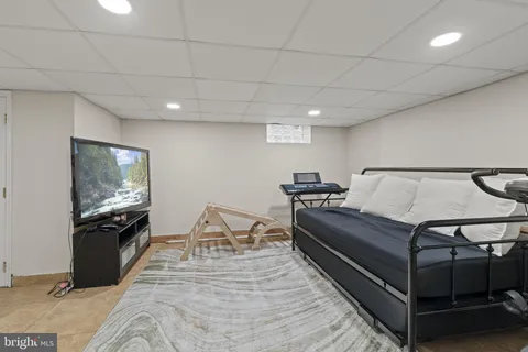 a spacious bedroom with a bed and a table