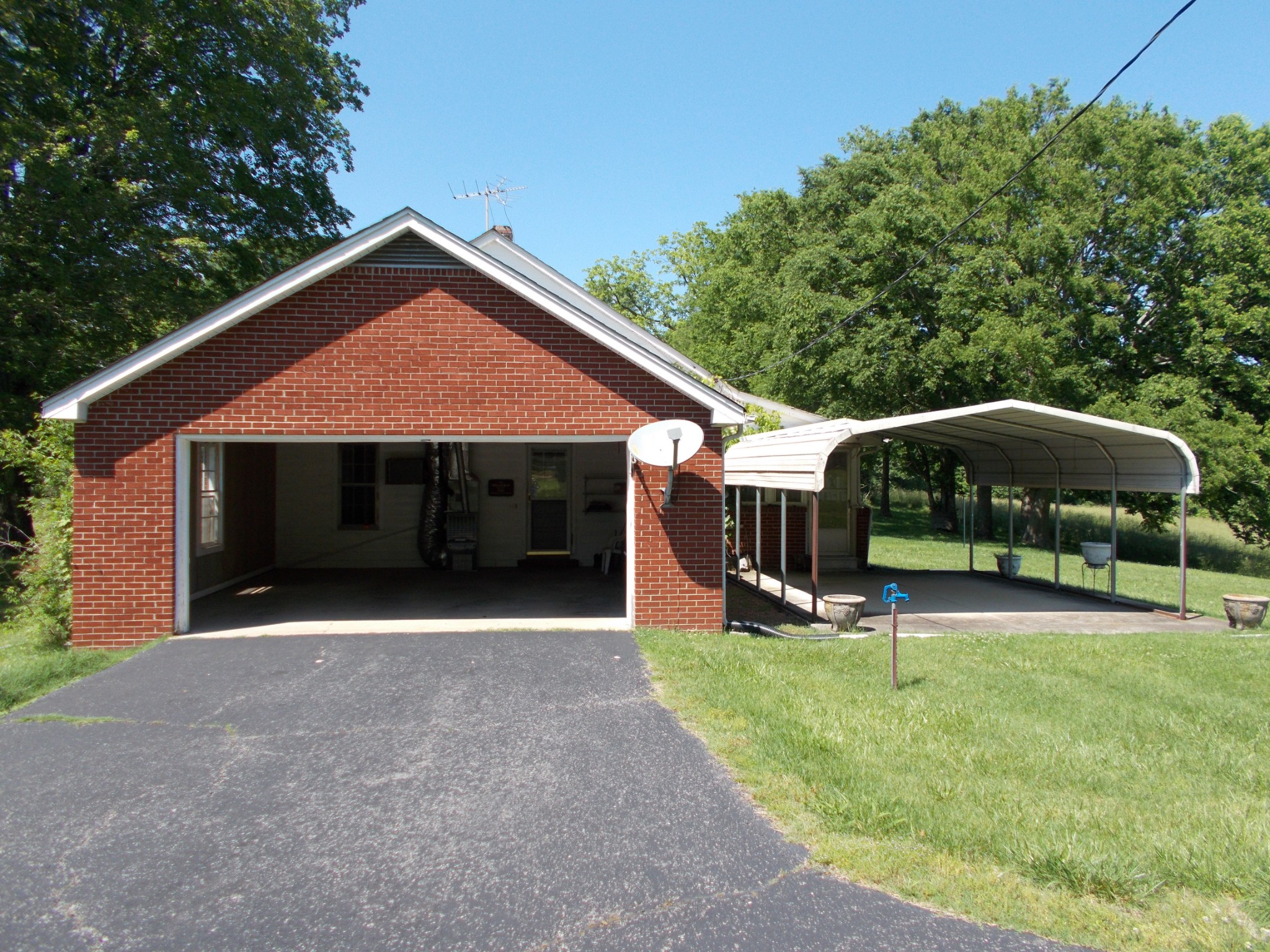 2846 Lockertsville Road Ashland City, TN 37015 - Photo 14 of 37 a front view of a house with garden