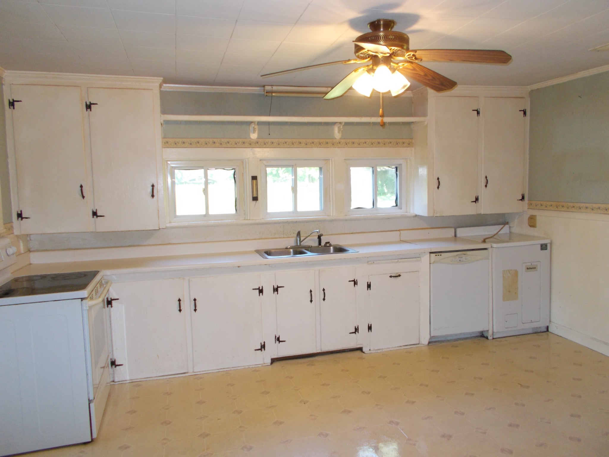 2846 Lockertsville Road Ashland City, TN 37015 - Photo 15 of 37 a kitchen with granite countertop a sink stainless steel appliances and cabinets