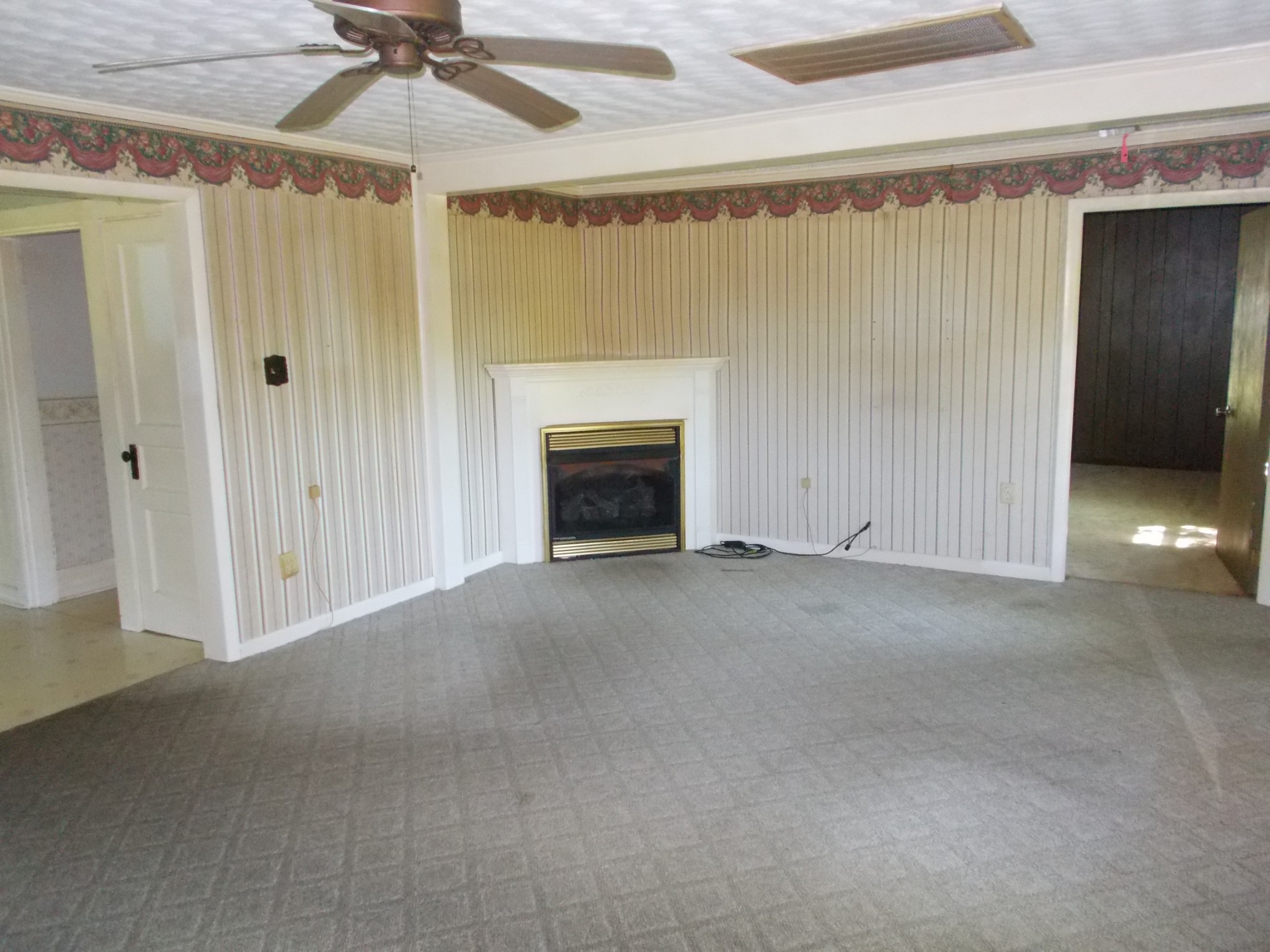 2846 Lockertsville Road Ashland City, TN 37015 - Photo 17 of 37 a view of empty room with fan and a fireplace