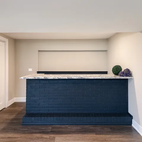 a view of a house with a yard and sitting area