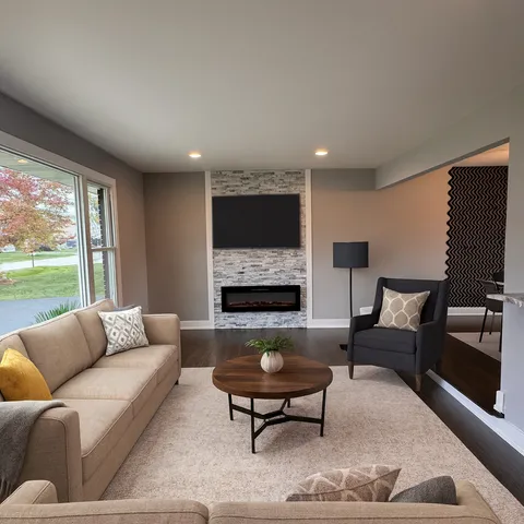 a living room with furniture and a flat screen tv