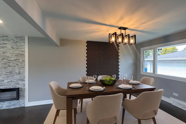 a view of a dining room with furniture and window