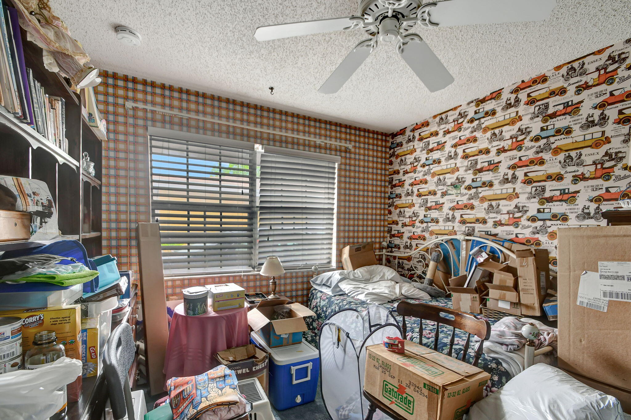 1853 Service Road North Palm Beach, FL 33408 - Photo 12 of 113 a fan room with furniture and a chandelier