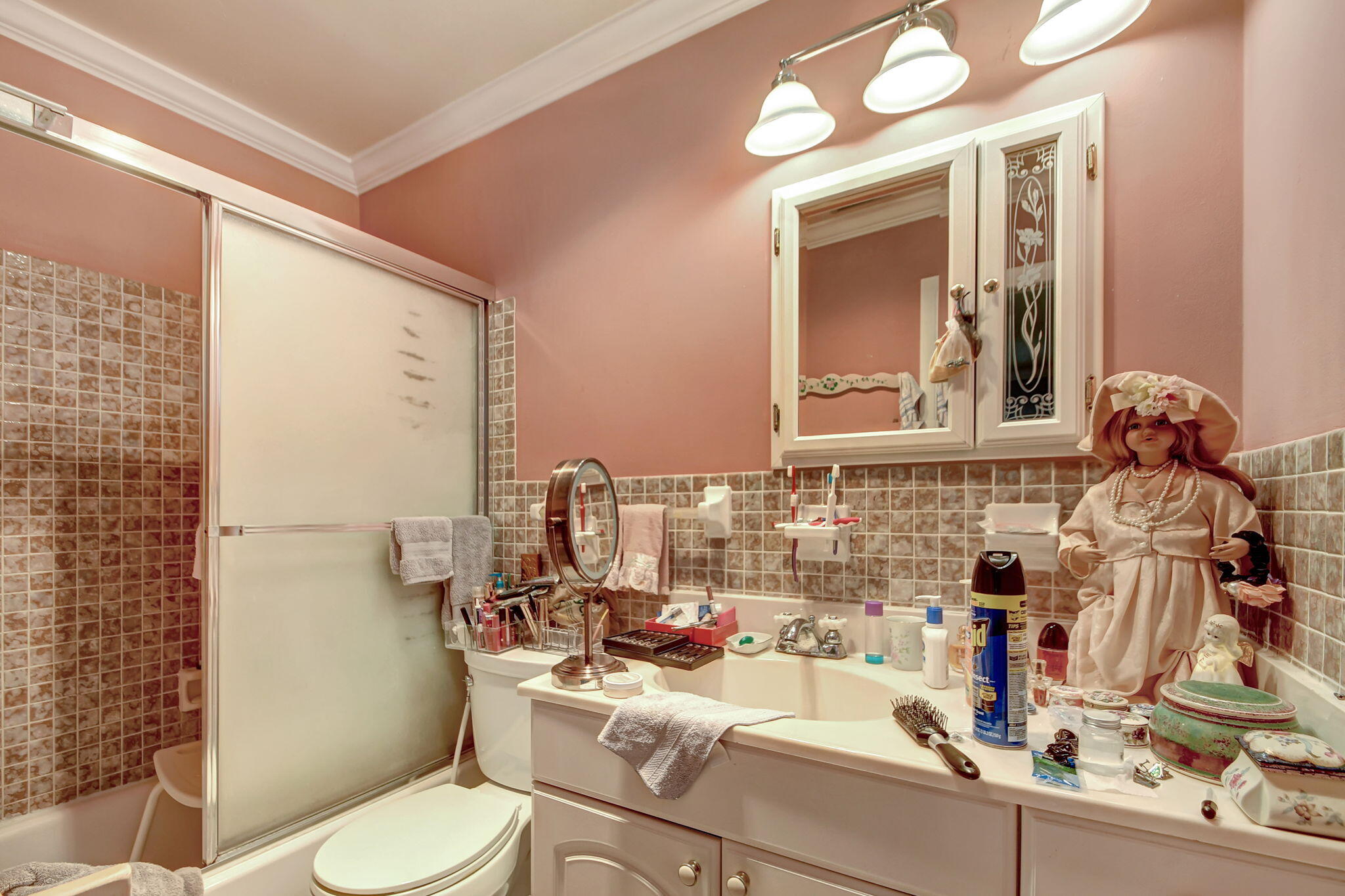 1853 Service Road North Palm Beach, FL 33408 - Photo 16 of 113 a bathroom with a sink mirror vanity and toilet