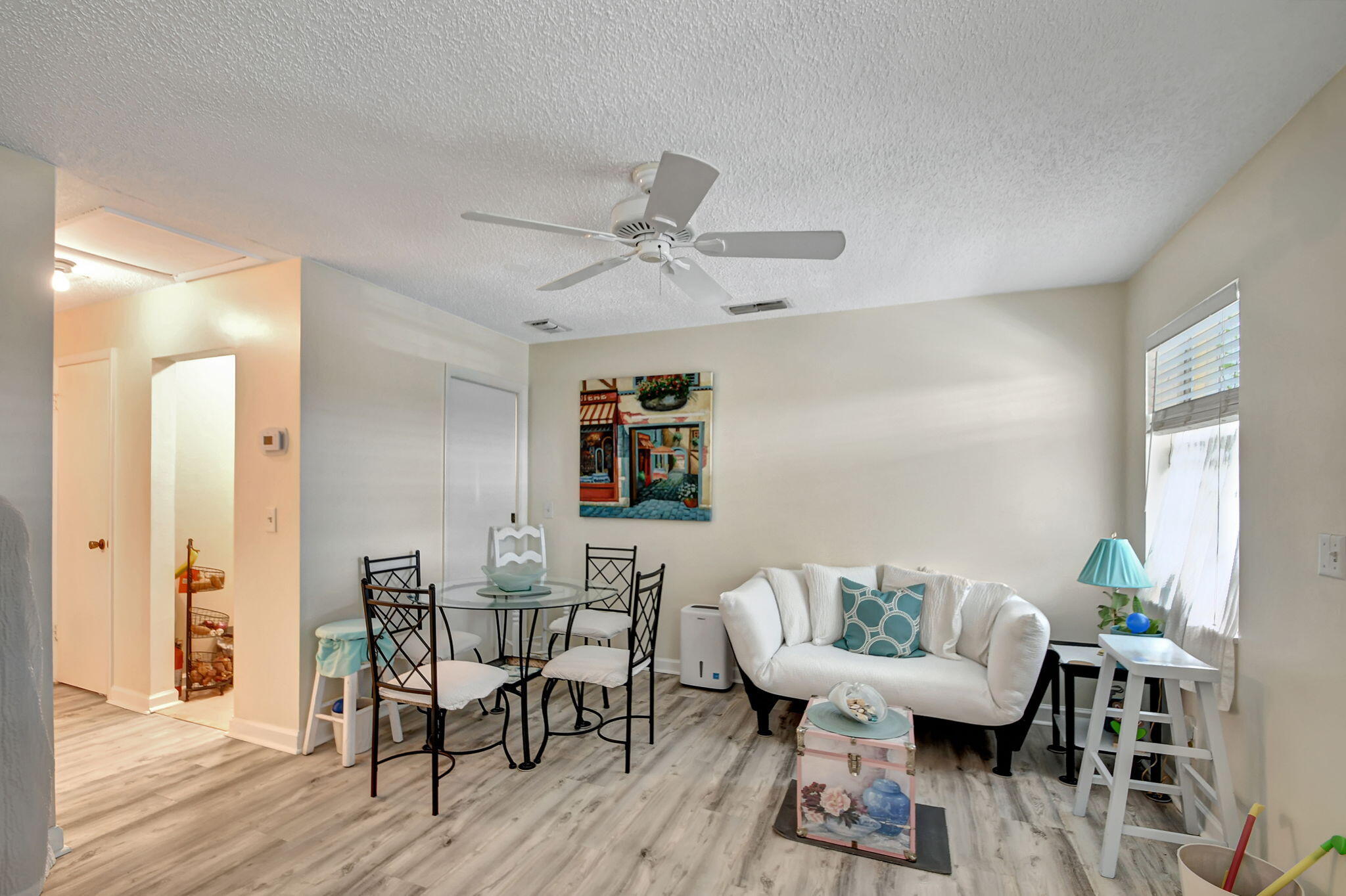 1853 Service Road North Palm Beach, FL 33408 - Photo 26 of 113 a view of a dining room with furniture and wooden floor