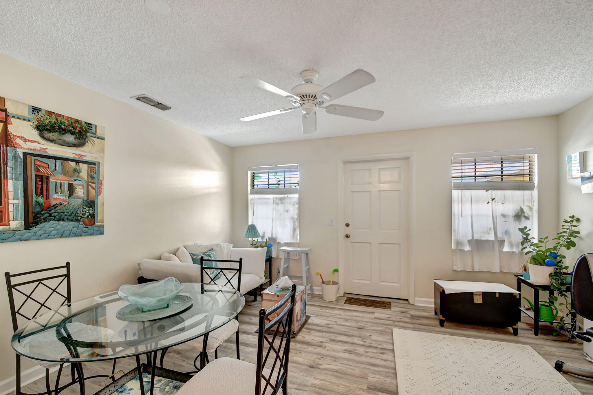 1853 Service Road North Palm Beach, FL 33408 - Photo 27 of 113 a view of a livingroom with furniture window and wooden floor