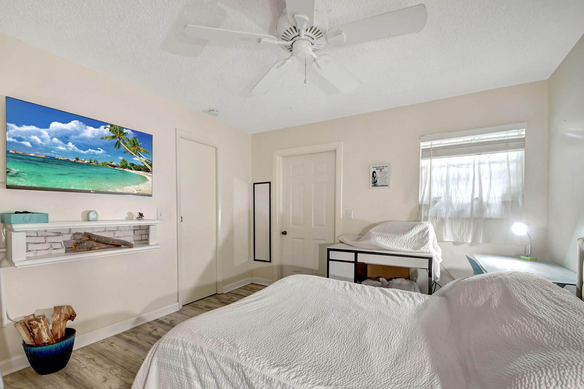 1853 Service Road North Palm Beach, FL 33408 - Photo 32 of 113 a bedroom with a bed and a flat screen tv