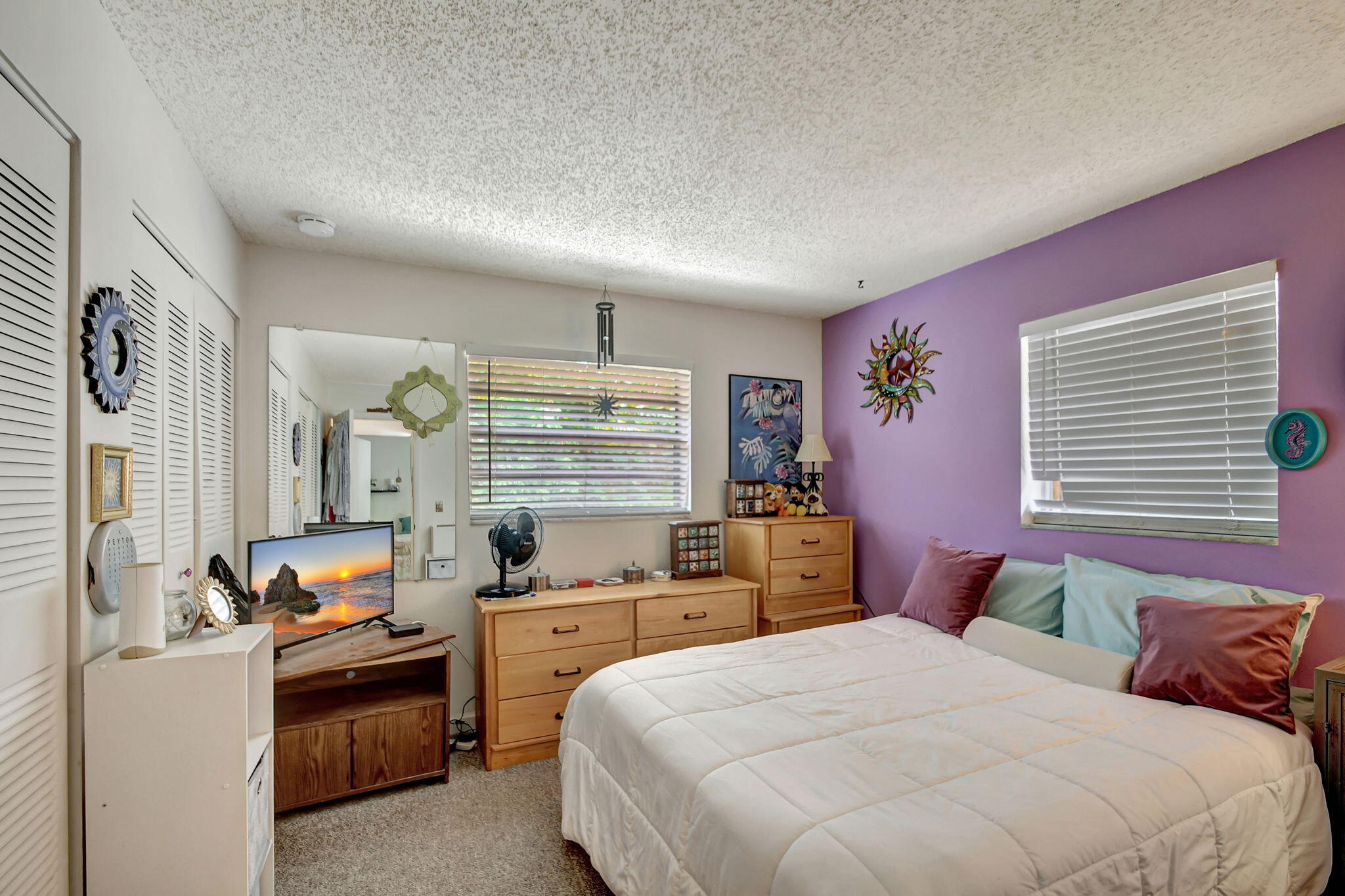 1853 Service Road North Palm Beach, FL 33408 - Photo 47 of 113 a bedroom with a bed and a cabinets