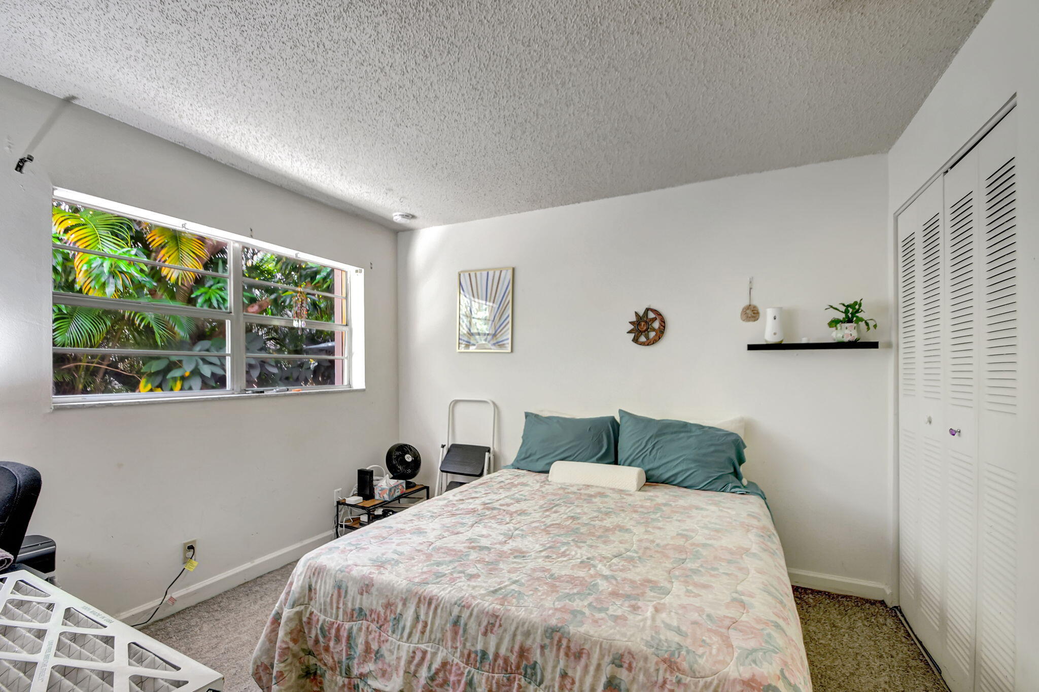 1853 Service Road North Palm Beach, FL 33408 - Photo 51 of 113 a bedroom with a bed and a window