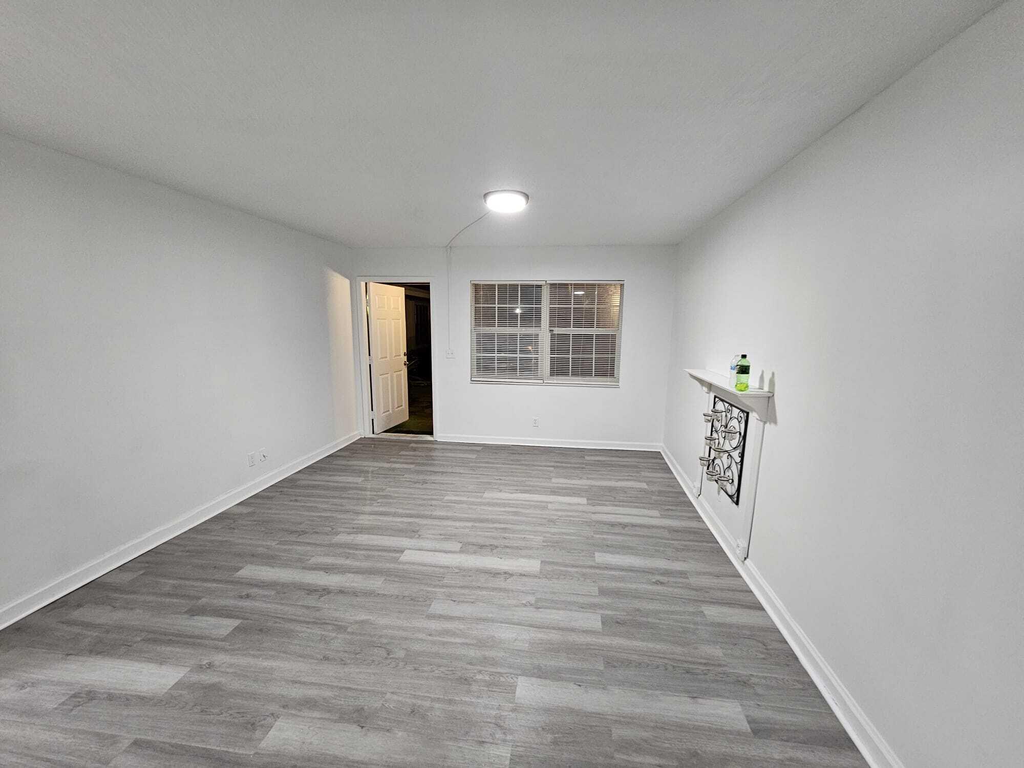 1853 Service Road North Palm Beach, FL 33408 - Photo 66 of 113 a view of an empty room with a window