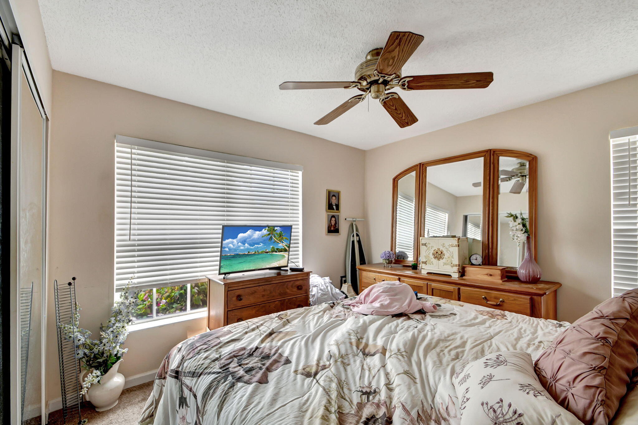 1853 Service Road North Palm Beach, FL 33408 - Photo 70 of 113 a bedroom with a large bed and a large window