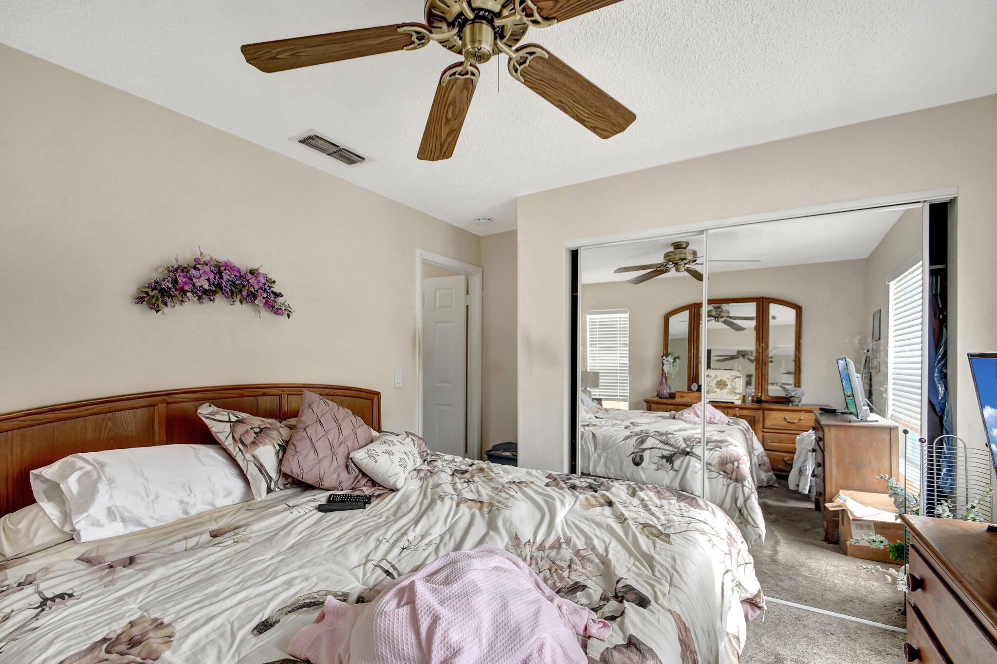 1853 Service Road North Palm Beach, FL 33408 - Photo 72 of 113 a bedroom with a bed and wooden floor