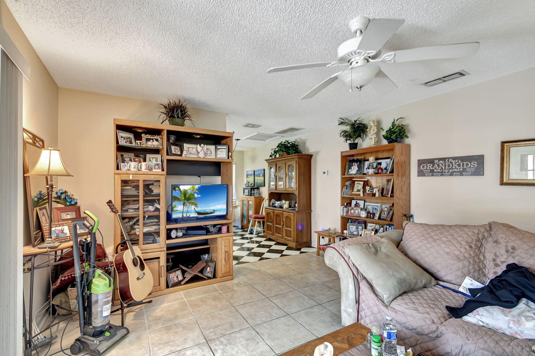 1853 Service Road North Palm Beach, FL 33408 - Photo 78 of 113 a living room with furniture and a flat screen tv