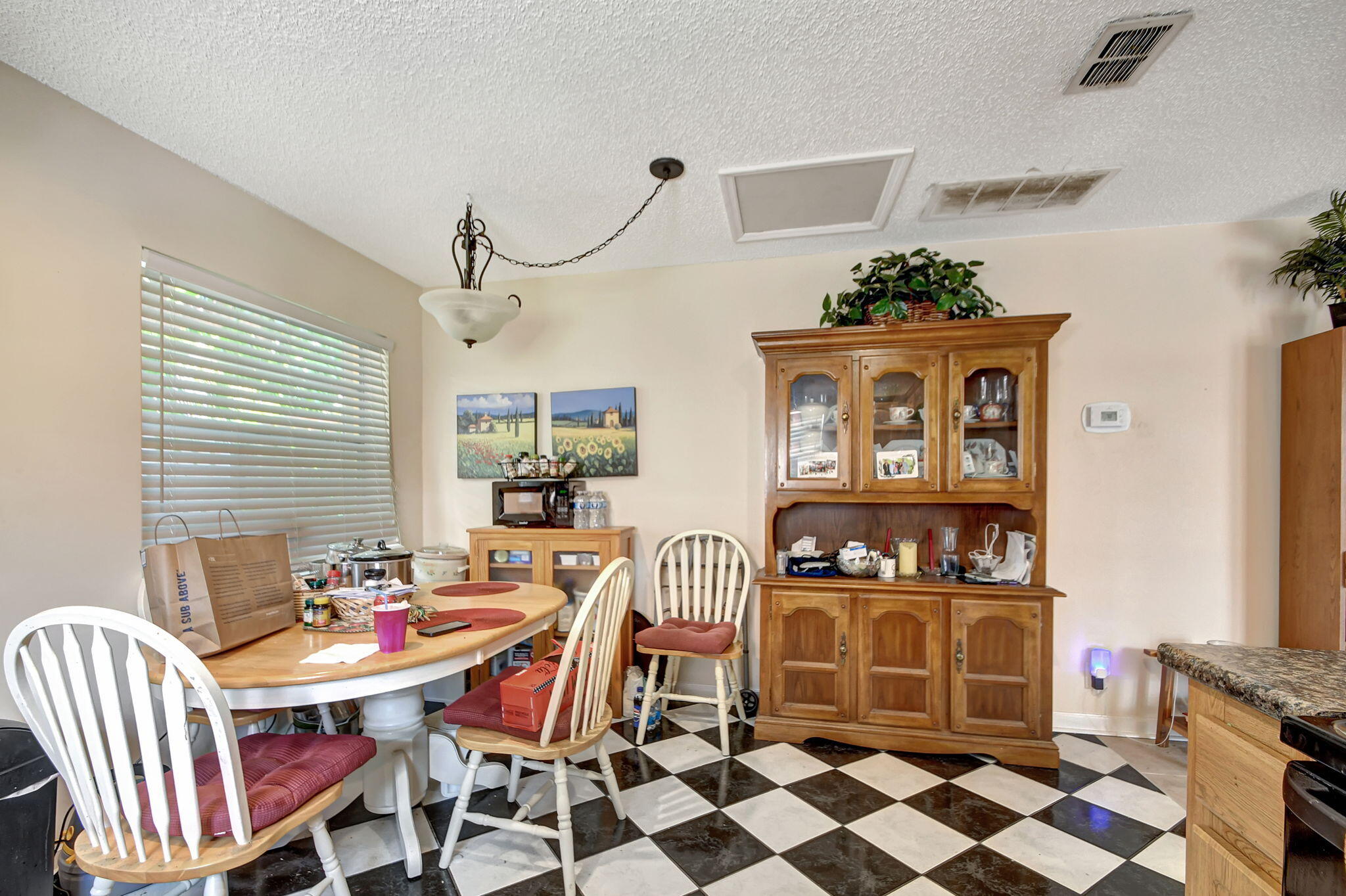 1853 Service Road North Palm Beach, FL 33408 - Photo 82 of 113 a dining room with furniture and window
