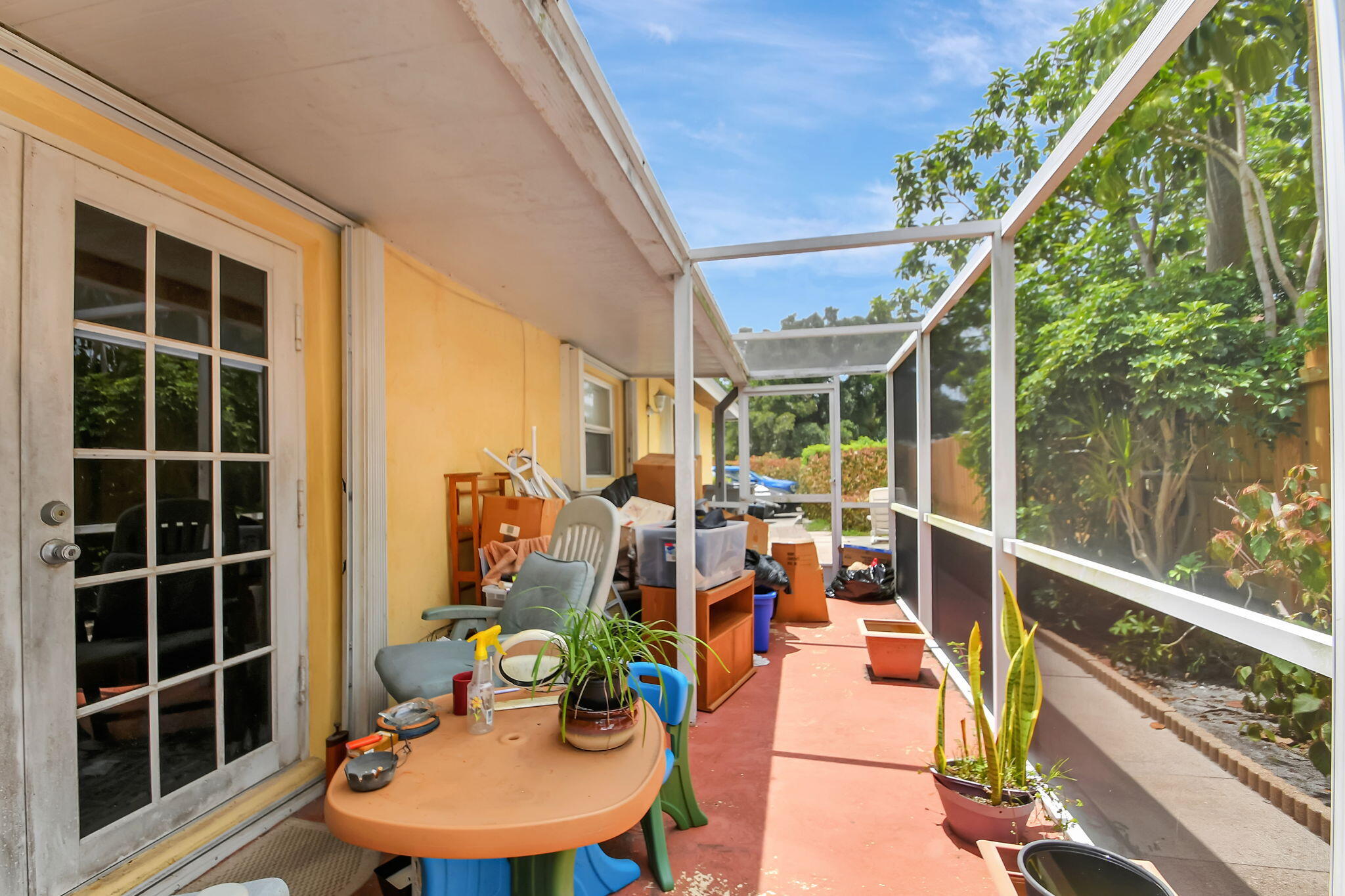 1853 Service Road North Palm Beach, FL 33408 - Photo 83 of 113 a view of a balcony with chairs and potted plants
