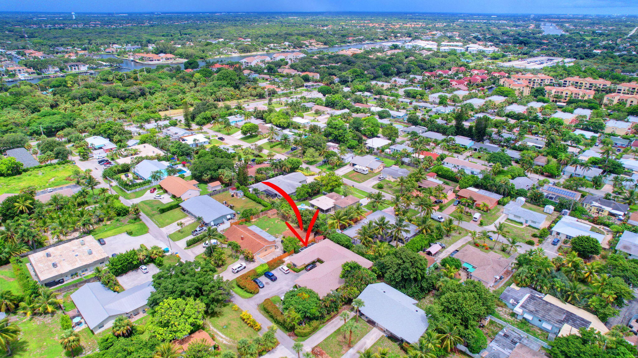 1853 Service Road North Palm Beach, FL 33408 - Photo 98 of 113 an aerial view of residential houses with outdoor space and trees