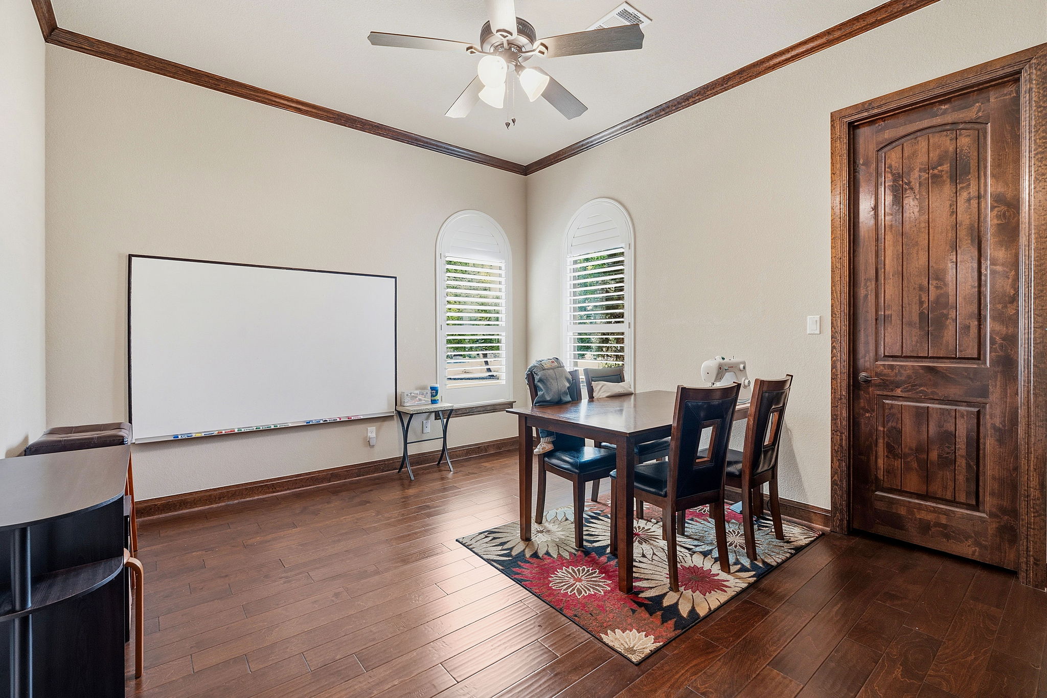 816 Brave Face Street Leander, TX 78641 - Photo 13 of 40 Rich hardwood flooring and crown molding define this versatile dining or study space.