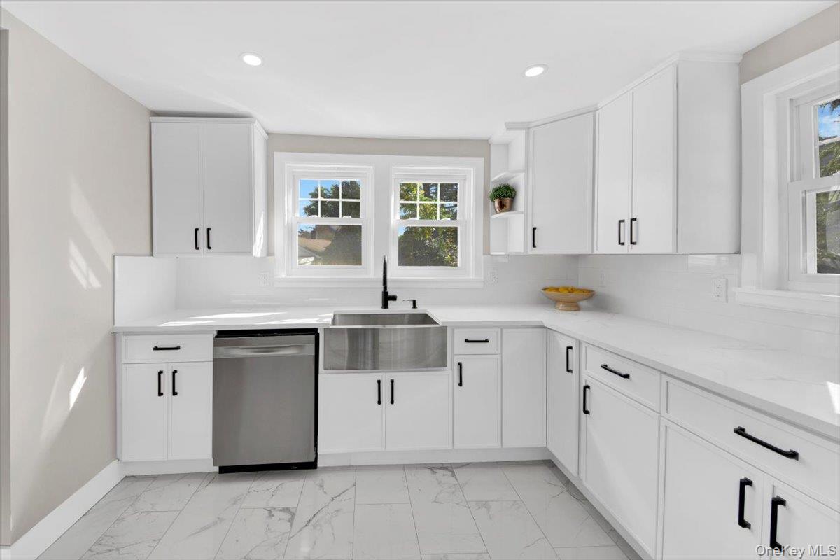 34 Kings Ferry Road Montrose, NY 10548 - Photo 13 of 36 Kitchen featuring white cabinets, light marble finish floors, open shelves, stainless steel dishwasher, and decorative backsplash