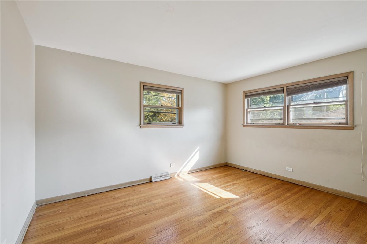 1009 South Washington Avenue Park Ridge, IL 60068 - Photo 11 of 24 a view of empty room with wooden floor and fan