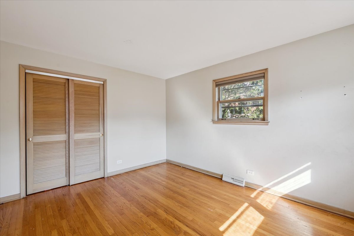 1009 South Washington Avenue Park Ridge, IL 60068 - Photo 12 of 24 a view of an empty room with wooden floor