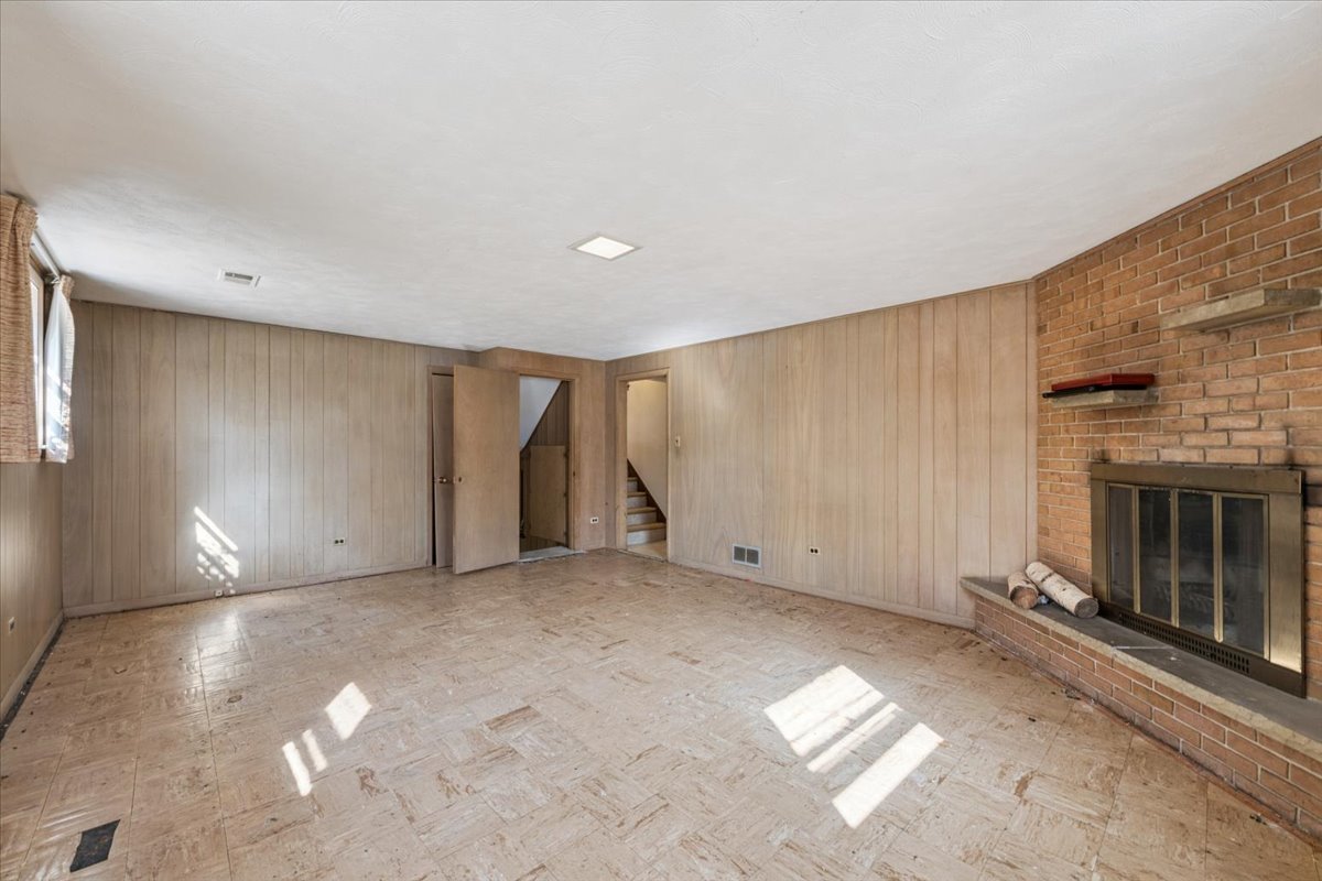 1009 South Washington Avenue Park Ridge, IL 60068 - Photo 16 of 24 a view of an empty room with a fireplace