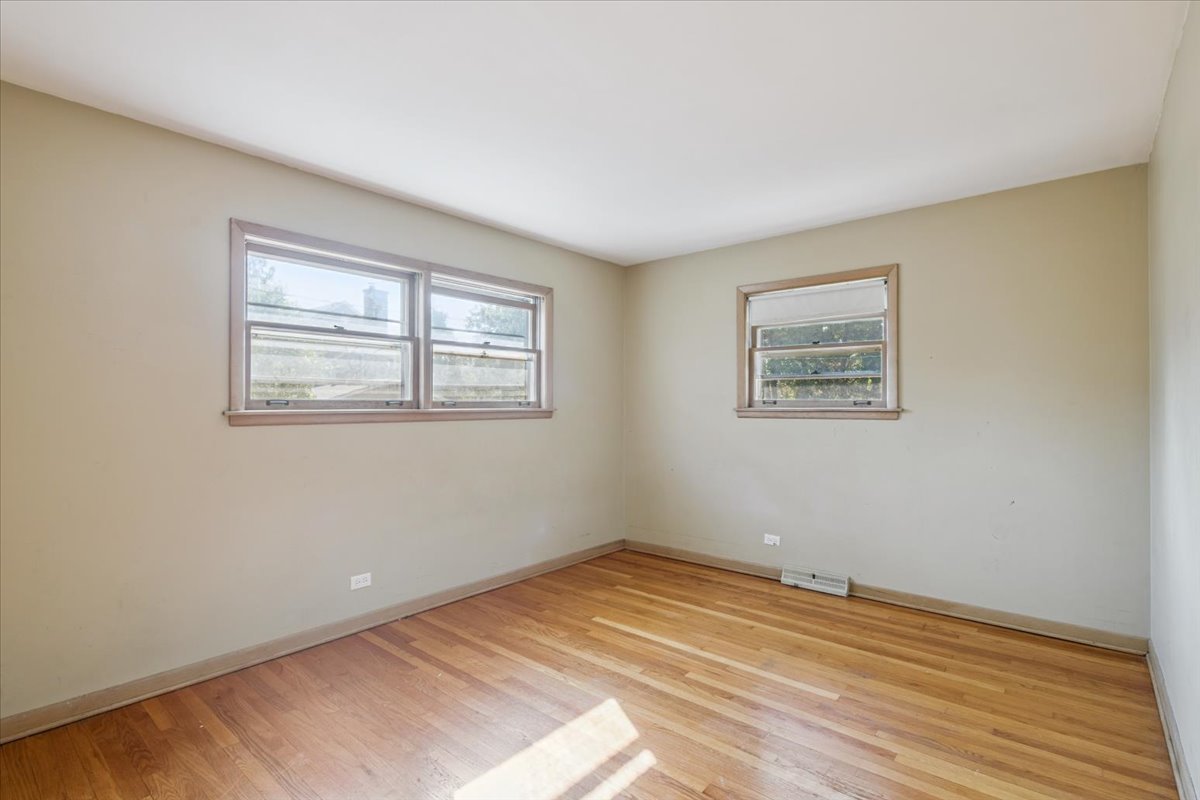 1009 South Washington Avenue Park Ridge, IL 60068 - Photo 9 of 24 a view of a room with wooden floor and window