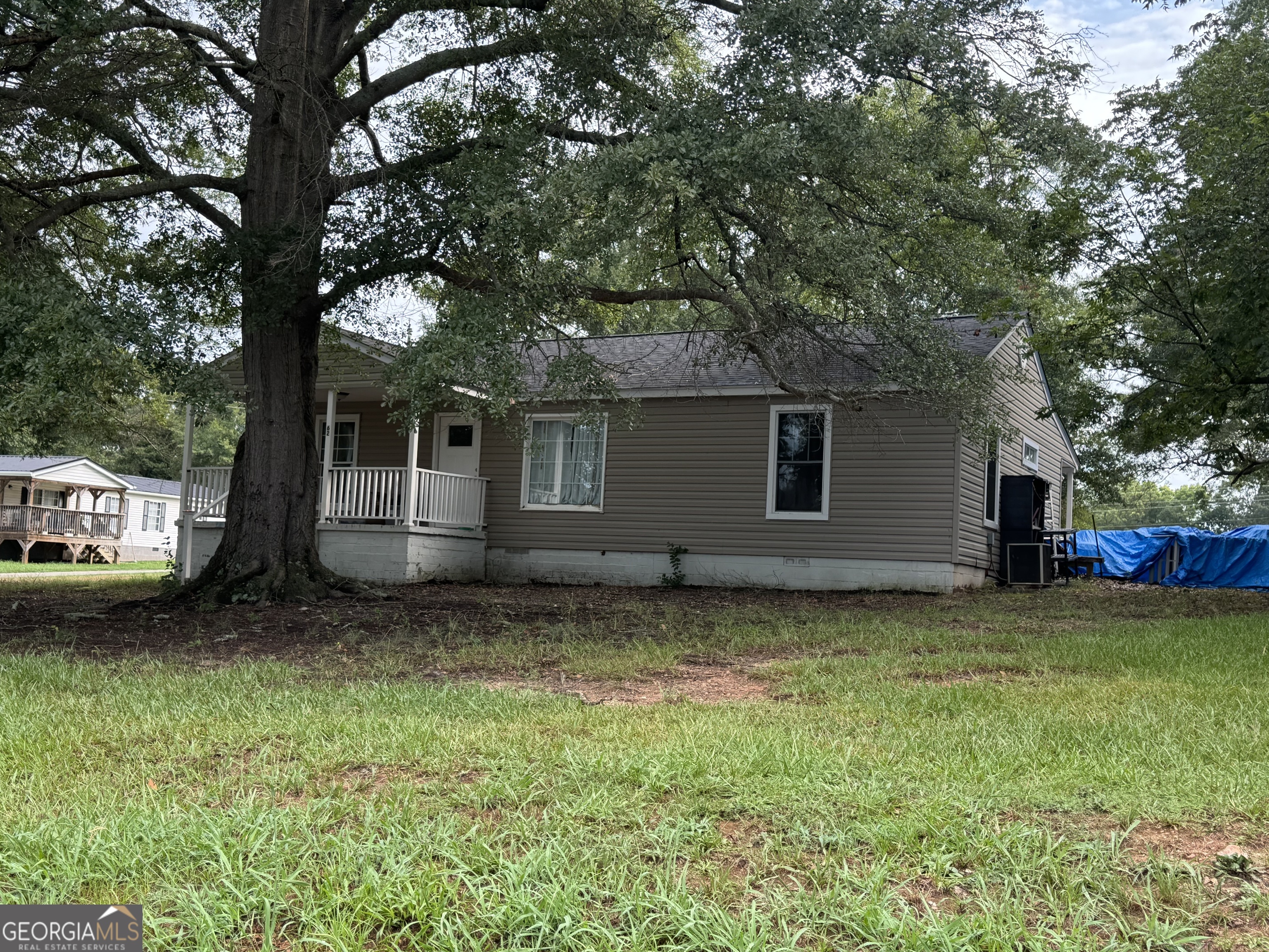 62 Atlanta Avenue Hartwell, GA 30643 - Photo 1 of 1 a view of a house with a yard
