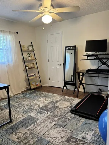 a view of a livingroom with furniture and staircase