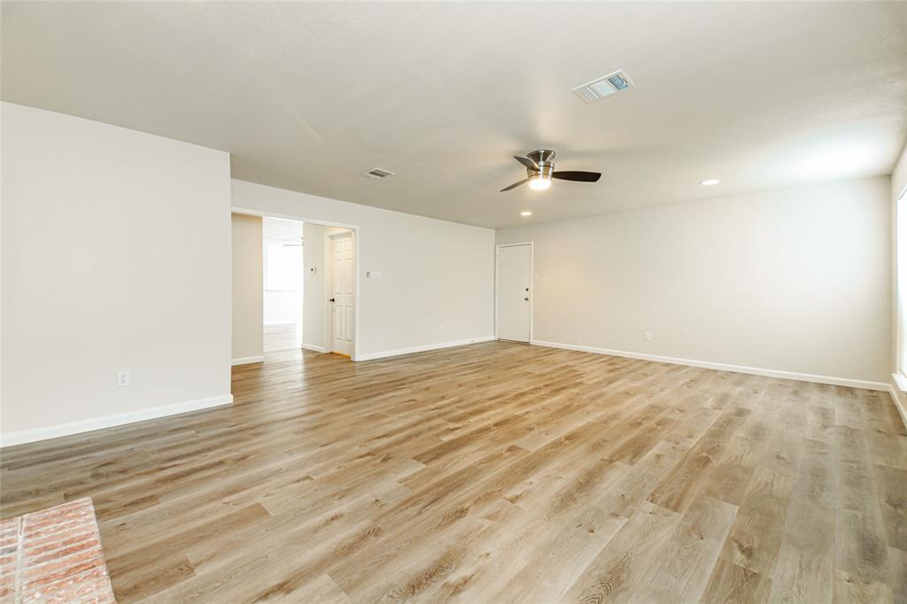 813 Ridgemont Drive Allen, TX 75002 - Photo 15 of 27 Unfurnished room featuring ceiling fan, light wood-type flooring, and recessed lighting