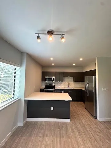 a kitchen with a sink and cabinets