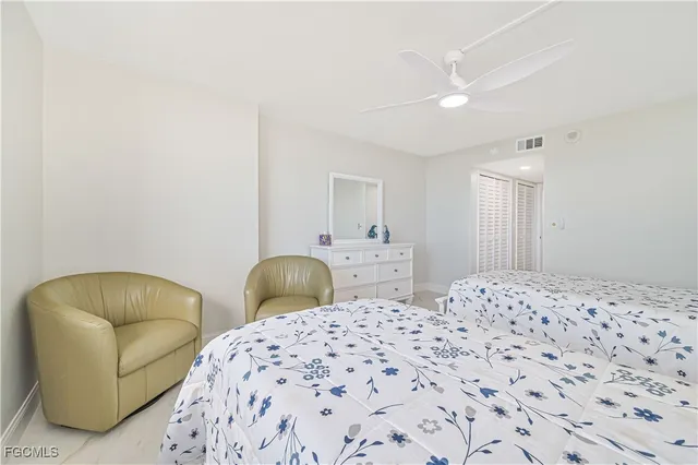 a bathroom with a toilet a sink and a mirror