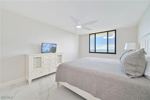 a bedroom with a bed and a night stand